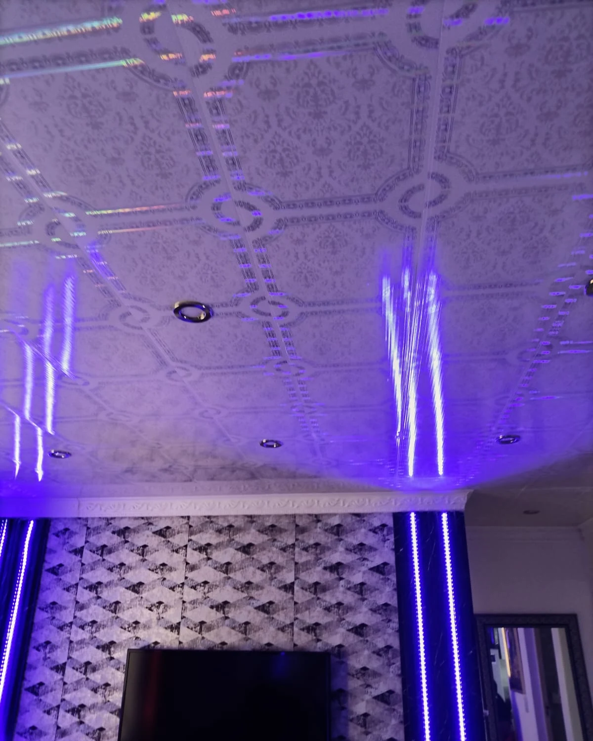 Patterned PVC ceiling with downlights and cornices